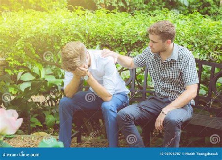 A man is consoled by a woman as he rests his head on the dinner table in Smiles of a Summer Night