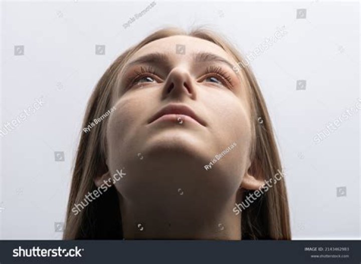 A woman looking up in Goodbye To Language.