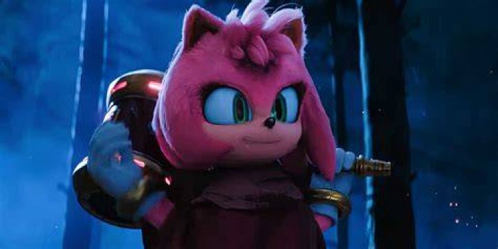 Amy holds a gun between her thighs in Beef