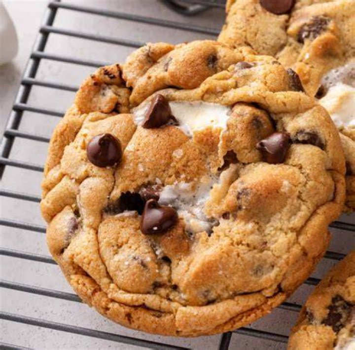 Aunt May bakes cookies as Spider-Ma'am in the comics