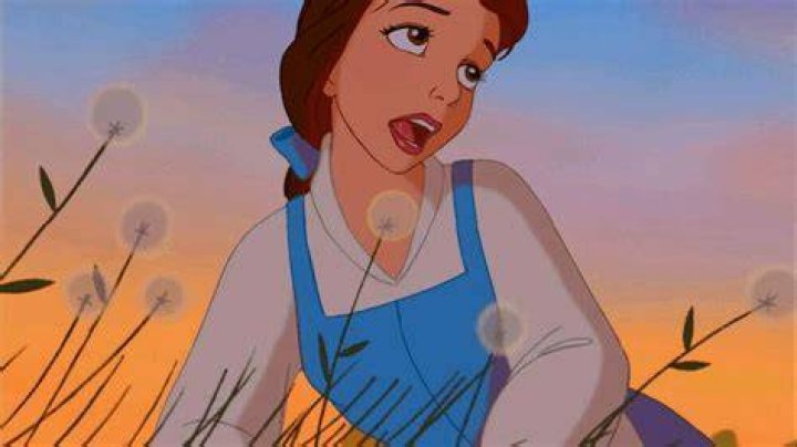 Belle singing in a field in Beauty and the Beast