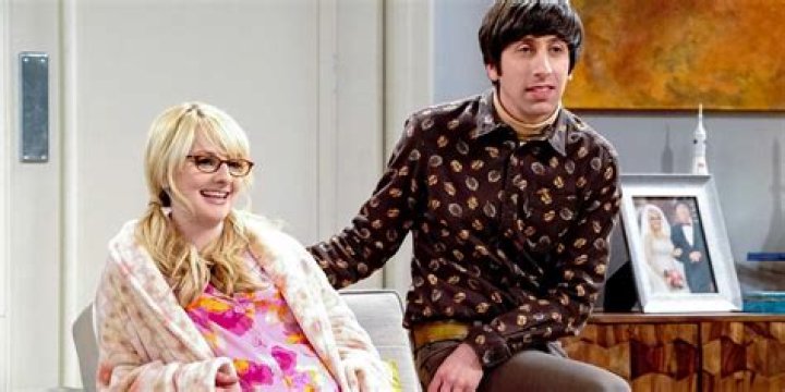 Bernadette comforting Howard on a couch in The Big Bang Theory