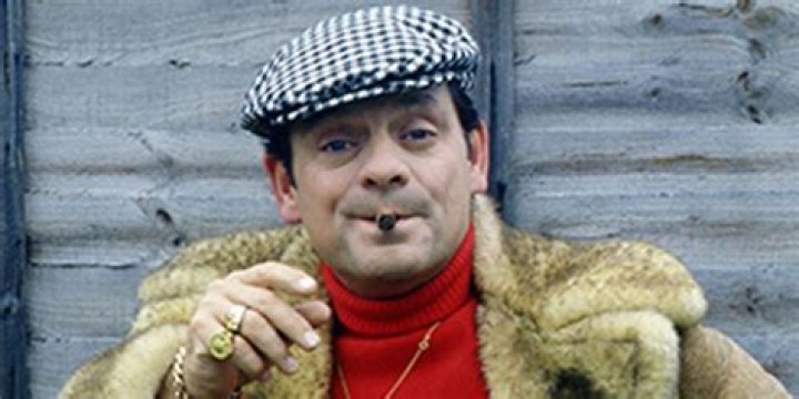 Del-boy smokes a cigar in Only Fools And Horses