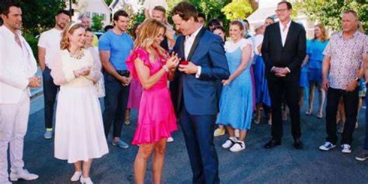 DJ accepting Steve's proposal in front of all her family and friends