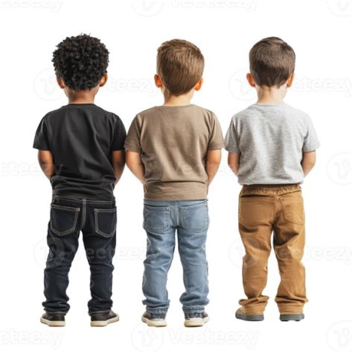Four kids behind an office desk, one of whom holds a magnifying glass, in The Inbestigators