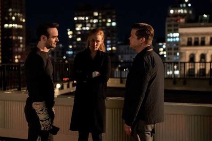 Karen and Will interact while in the living room with Grace and Jack