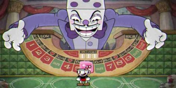 King Dice leers over Cuphead in his boss fight.