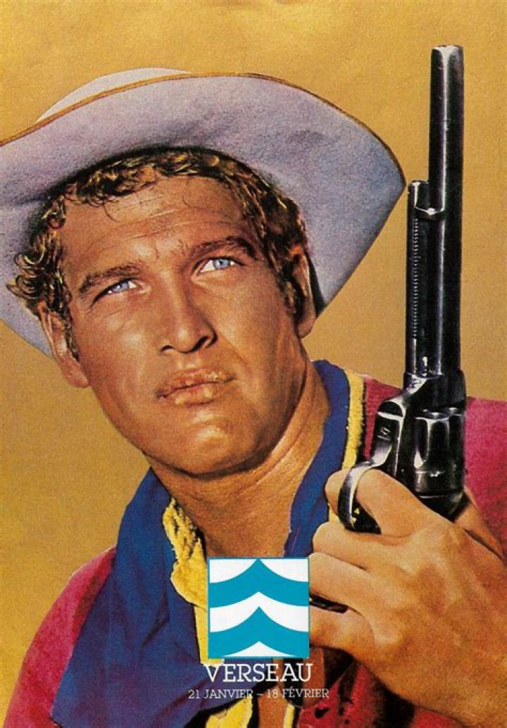 Paul Newman holding a gun.