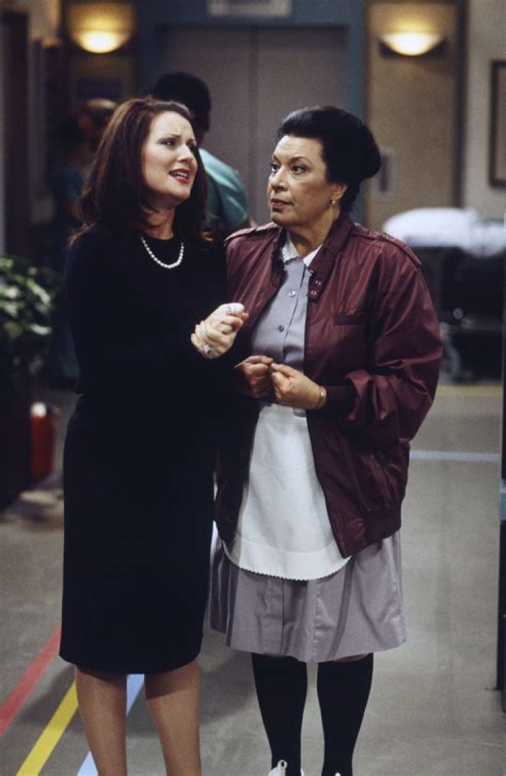 Rosario and Karen look at each other in Will and Grace
