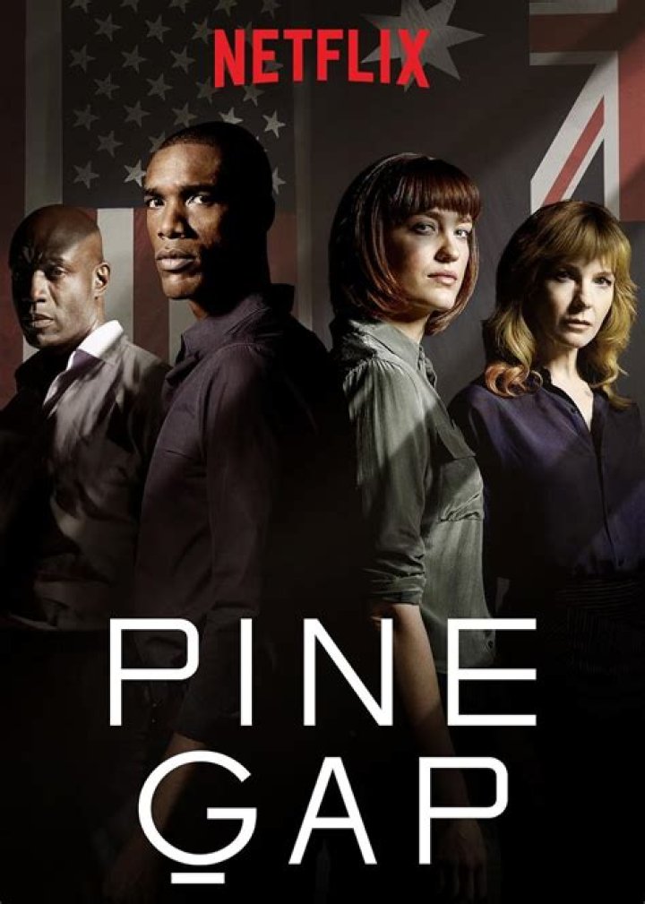 The cast of Pine Gap stands together, ominously staring at the camera