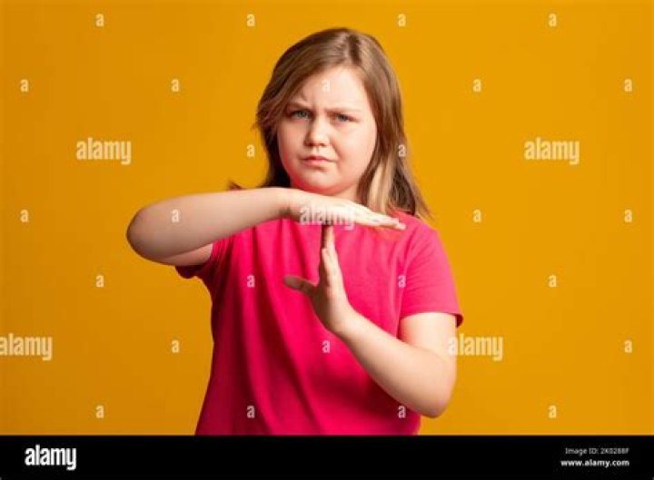 time up child strike pause break hand signal girl Stock Photo Alamy