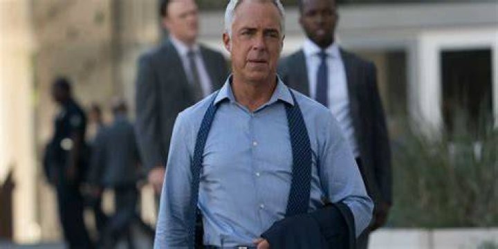 Titus Welliver walking down the street in Bosch
